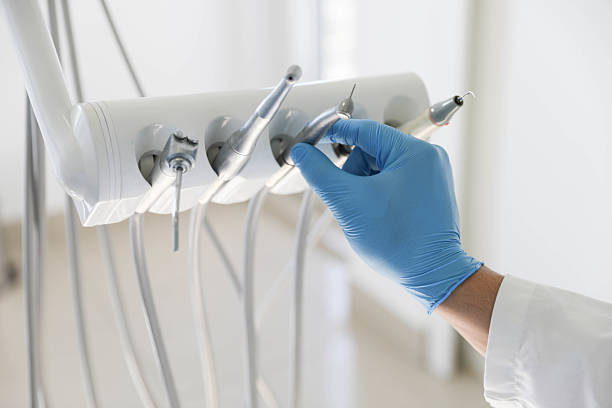 Professional Tooth Extraction technician working in Pinckney, MI